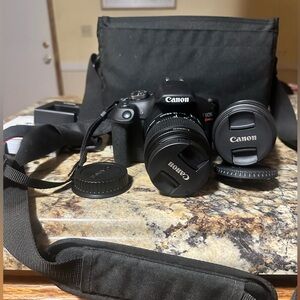 Canon EOS Rebel T7 (Kit with 18-55mm and 75-300mm Lenses + Shoulder Bag.